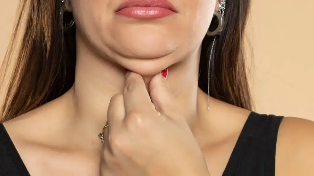 An image of a woman with double chin, sad, worried : Non Surgical Double Chin Removal Treatment in Pinner, UK